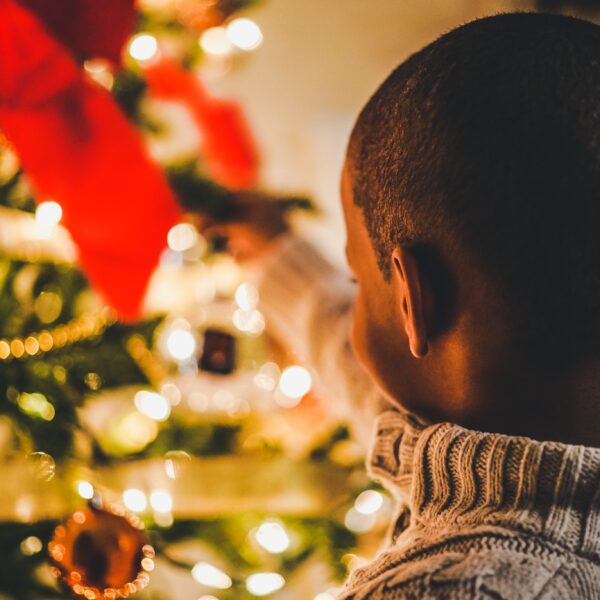 Child looking at Christmas Tree